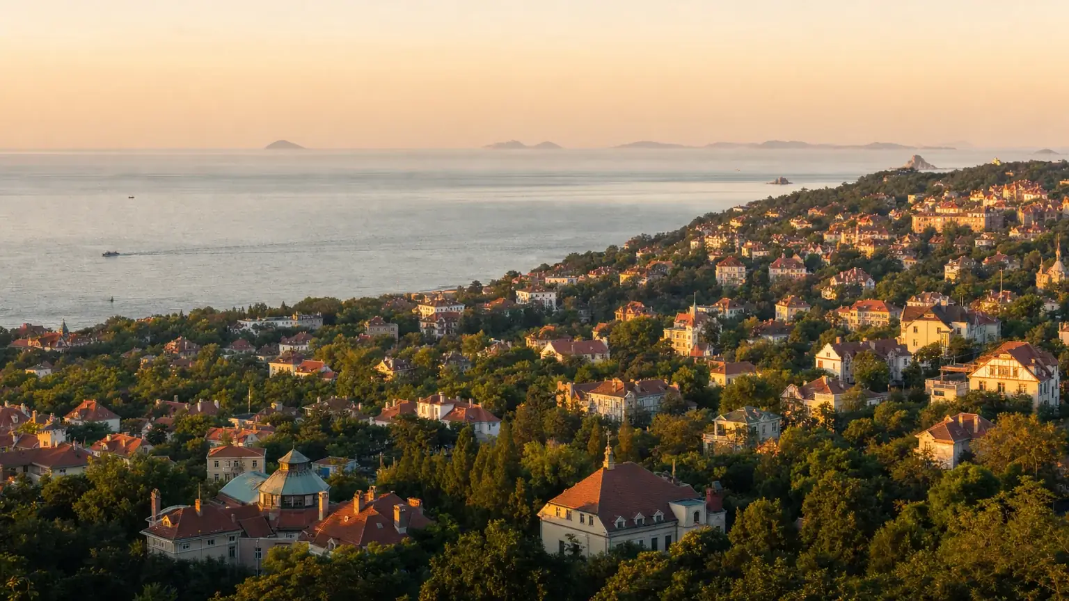 The red-roofed old town of Qingdao above the sea at golden hour